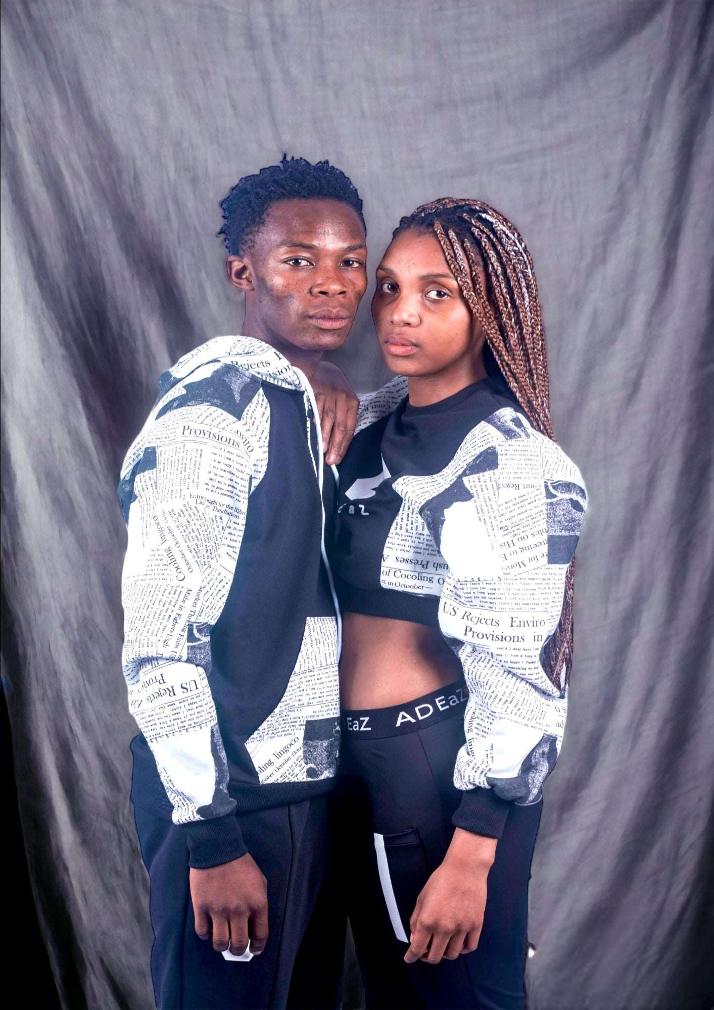 Men's black paper print track hoodie with a modern and stylish design, perfect for urban and athletic wear.