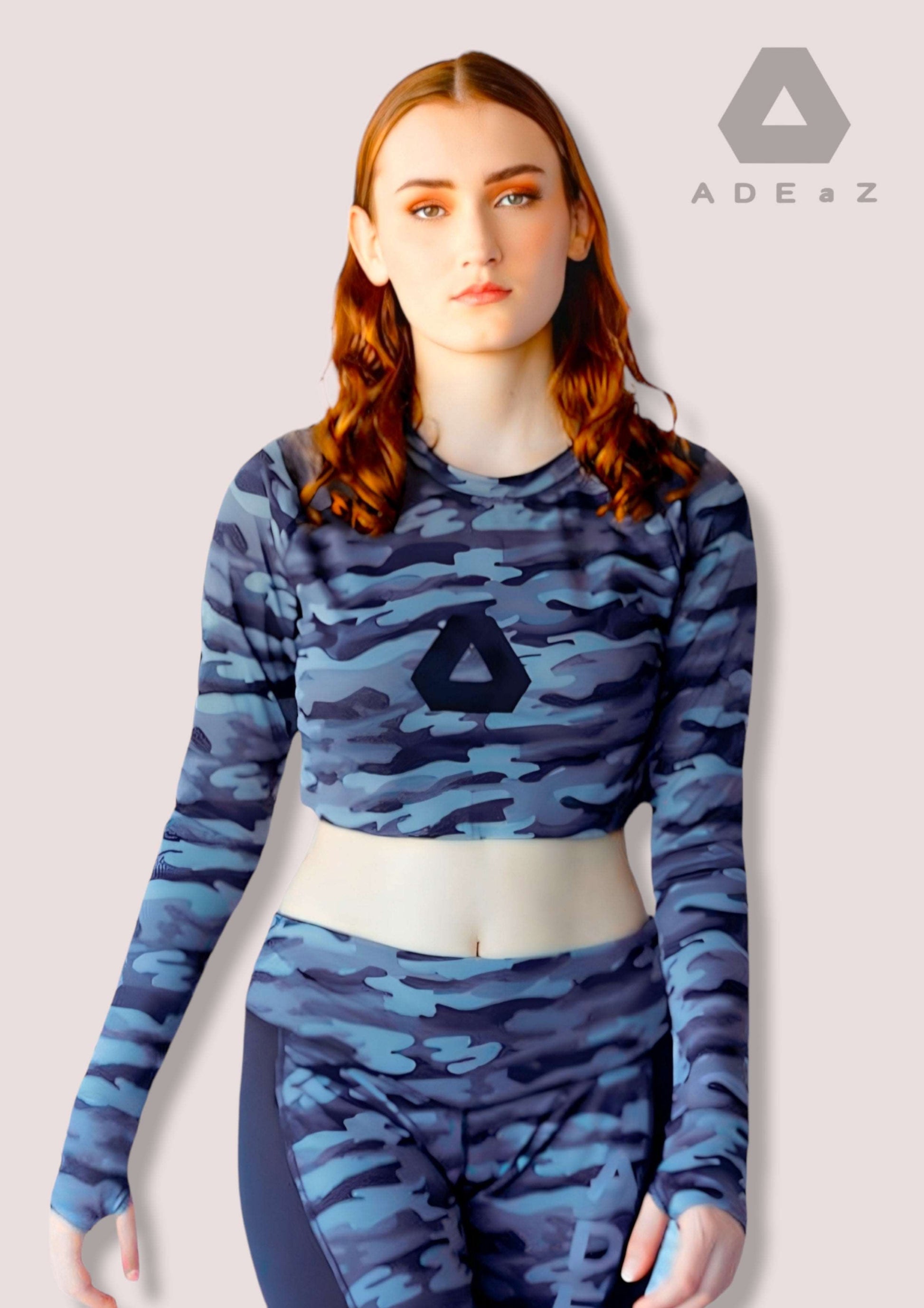 Camo Crop Top with Thumbhole: Camouflage patterned sleeveless crop top with built-in thumbholes for added style and comfort.