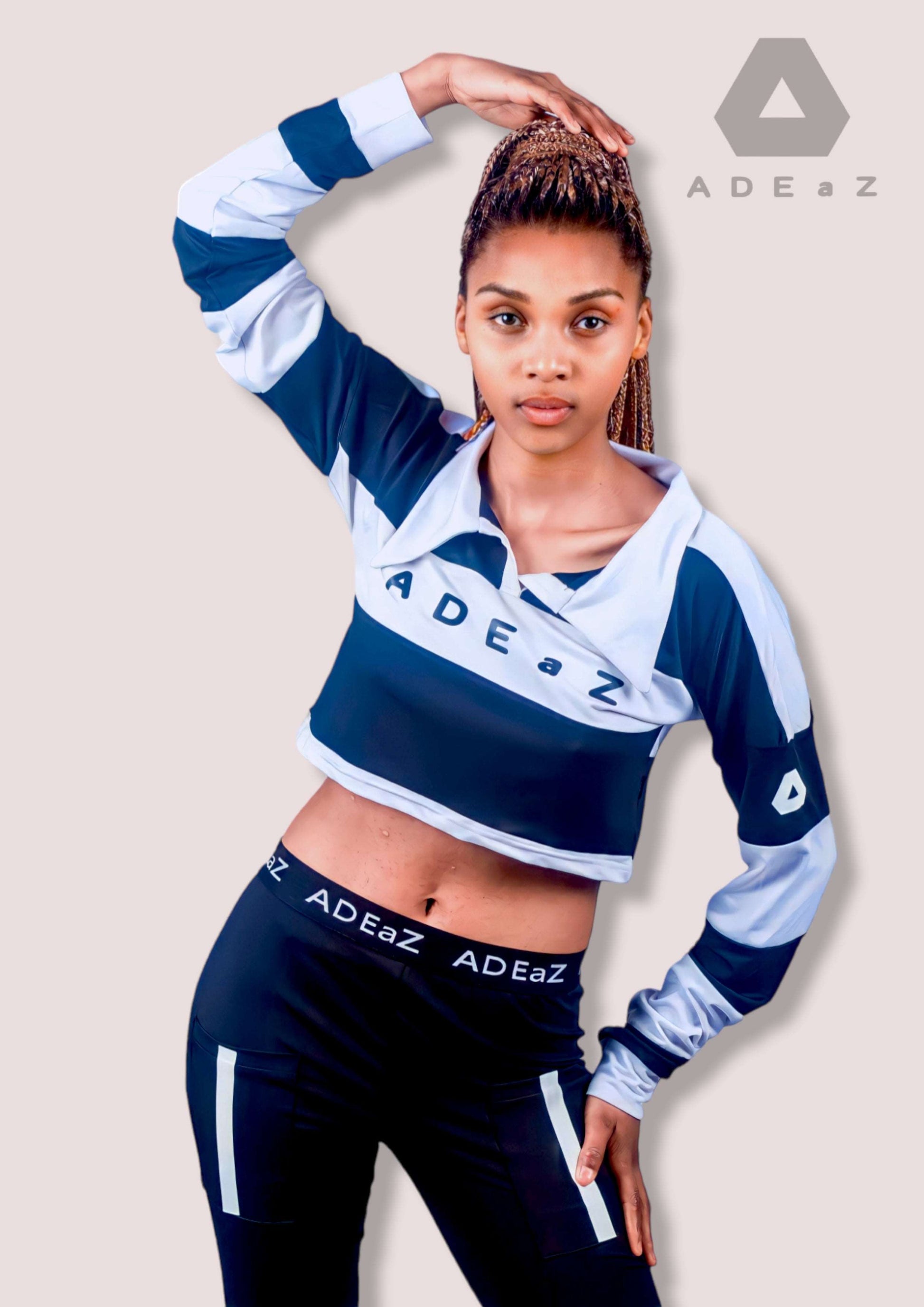 Women's long-sleeve collar crop top in soft colors, offering a stylish blend of sophistication and trendy design.